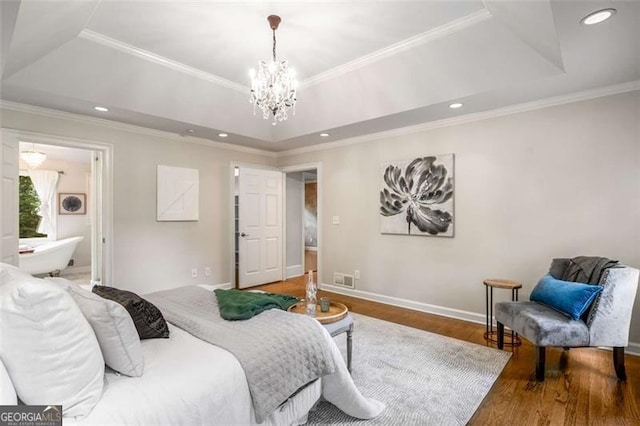 1041 Standard Dr, Brookhaven, GA 30319 - bedroom featuring a raised ceiling, wood finished floors, a chandelier, ornamental molding, and baseboards