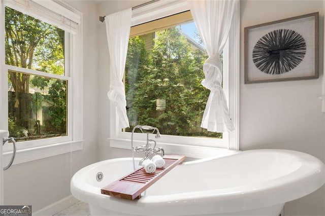 1041 Standard Dr, Brookhaven, GA 30319 - bathroom featuring a soaking tub and baseboards