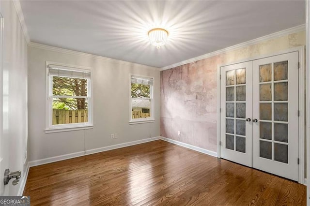 1041 Standard Dr, Brookhaven, GA 30319 - spare room with french doors, wood finished floors, crown molding, and baseboards