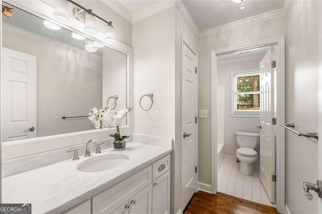 1041 Standard Dr, Brookhaven, GA 30319 - full bath with toilet, vanity, a tub to relax in, wood finished floors, and ornamental molding