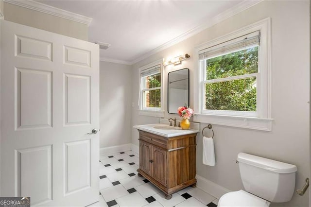 1041 Standard Dr, Brookhaven, GA 30319 - bathroom featuring tile patterned floors, baseboards, toilet, vanity, and crown molding