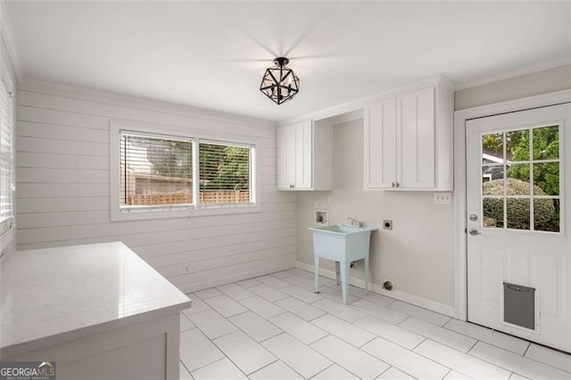 1041 Standard Dr, Brookhaven, GA 30319 - laundry area with hookup for an electric dryer, washer hookup, cabinet space, wooden walls, and crown molding