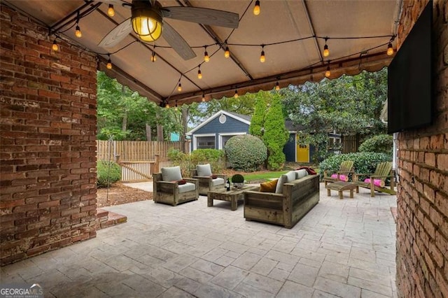 1041 Standard Dr, Brookhaven, GA 30319 - view of patio featuring an outdoor living space, a gazebo, fence, a ceiling fan, and an outbuilding