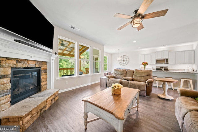 433 Crystal Way, Cornelia, GA 30531 - living room featuring ceiling fan, wood finished floors, baseboards, recessed lighting, and a stone fireplace