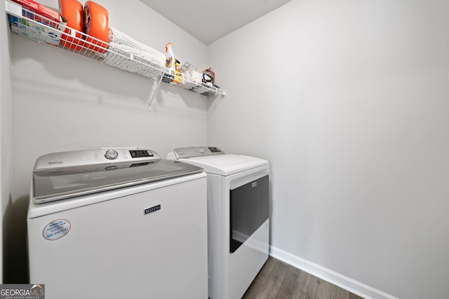 433 Crystal Way, Cornelia, GA 30531 - laundry area with separate washer and dryer, wood finished floors, and baseboards