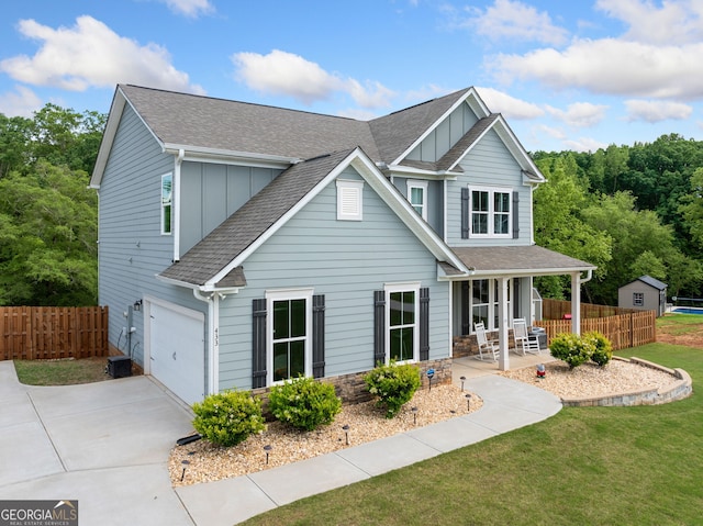 433 Crystal Way, Cornelia, GA 30531 - view of front of home with board and batten siding, a shingled roof, a garage, concrete driveway, and a porch