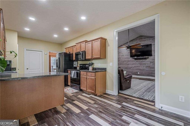 188 Cooper Creek Dr, Dallas, GA 30157 - kitchen with black electric range oven, stainless steel microwave, dark wood-style floors, recessed lighting, and brown cabinets