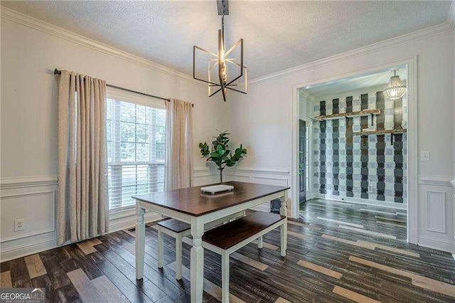 188 Cooper Creek Dr, Dallas, GA 30157 - dining room with a chandelier, dark wood finished floors, a decorative wall, crown molding, and a textured ceiling
