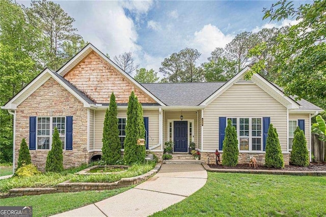 188 Cooper Creek Dr, Dallas, GA 30157 - view of front of home with stone siding, a front yard, and roof with shingles