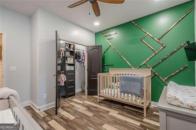 188 Cooper Creek Dr, Dallas, GA 30157 - bedroom with wood finished floors, a closet, baseboards, ceiling fan, and recessed lighting
