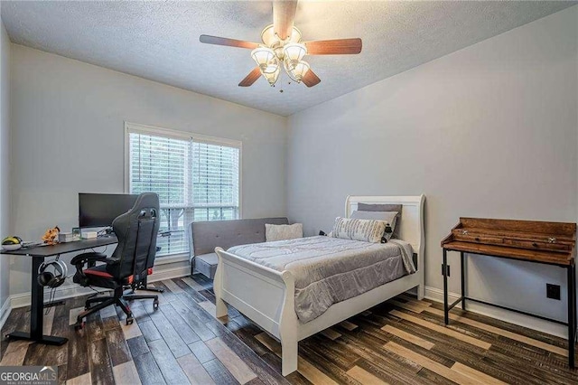 188 Cooper Creek Dr, Dallas, GA 30157 - bedroom featuring wood finished floors, a textured ceiling, baseboards, a desk, and ceiling fan