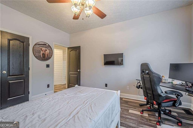 188 Cooper Creek Dr, Dallas, GA 30157 - bedroom with baseboards, a textured ceiling, wood finished floors, an office area, and a ceiling fan