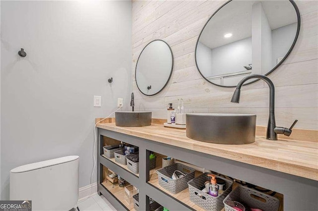 188 Cooper Creek Dr, Dallas, GA 30157 - bathroom with double vanity, toilet, and baseboards