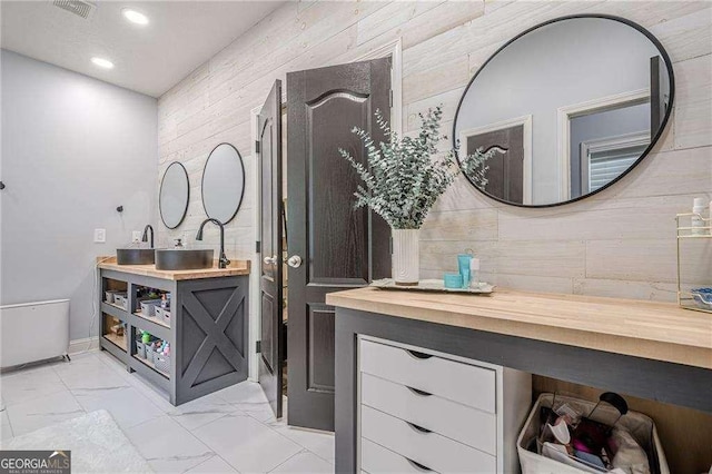 188 Cooper Creek Dr, Dallas, GA 30157 - full bath featuring marble finish flooring, recessed lighting, vanity, and wooden walls