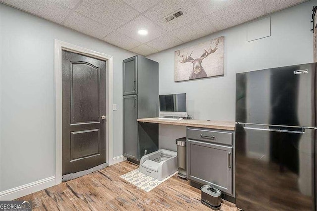 188 Cooper Creek Dr, Dallas, GA 30157 - office featuring a drop ceiling, light wood finished floors, baseboards, and built in desk