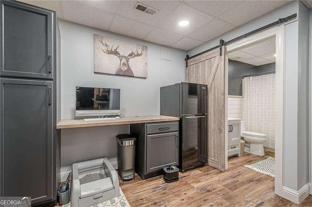 188 Cooper Creek Dr, Dallas, GA 30157 - bathroom with wood finished floors, toilet, a drop ceiling, and curtained shower