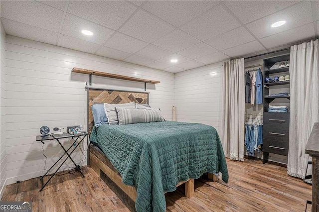 188 Cooper Creek Dr, Dallas, GA 30157 - bedroom featuring wood finished floors, recessed lighting, wood walls, and a drop ceiling