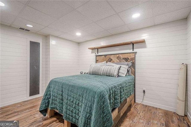 188 Cooper Creek Dr, Dallas, GA 30157 - bedroom with wood finished floors, recessed lighting, baseboards, wooden walls, and a paneled ceiling
