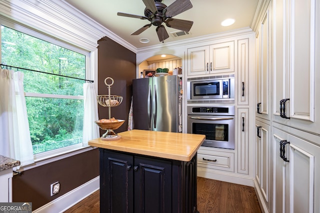 347 Brookridge Dr, Lagrange, GA 30241 - kitchen with stainless steel appliances, butcher block countertops, plenty of natural light, dark wood-style floors, and ornamental molding