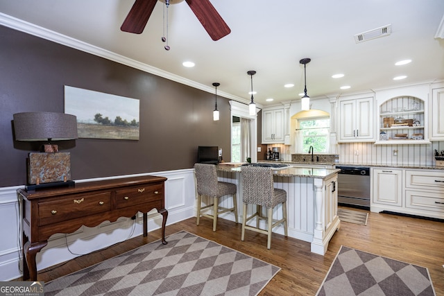347 Brookridge Dr, Lagrange, GA 30241 - kitchen featuring dishwasher, a sink, ornamental molding, light stone counters, and white cabinetry