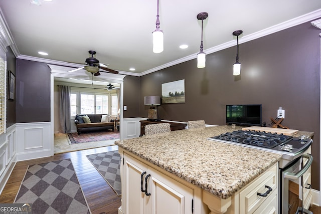 347 Brookridge Dr, Lagrange, GA 30241 - kitchen with stainless steel gas range, open floor plan, a ceiling fan, crown molding, and light stone countertops