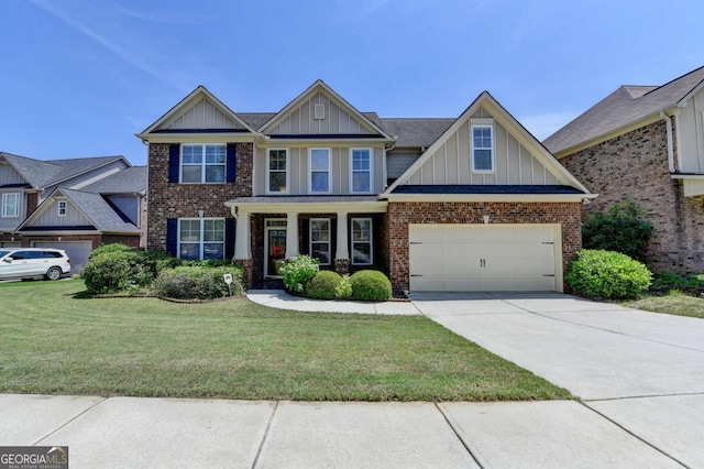 25 Kaktovic Ct, Grayson, GA 30017 - view of front facade featuring board and batten siding, driveway, a front yard, and brick siding