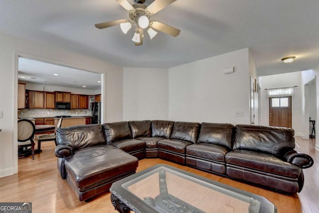 25 Kaktovic Ct, Grayson, GA 30017 - living room with light wood-style floors and ceiling fan