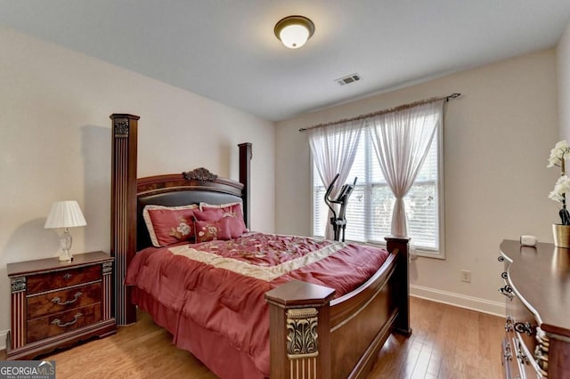 25 Kaktovic Ct, Grayson, GA 30017 - bedroom featuring multiple windows, wood finished floors, and baseboards