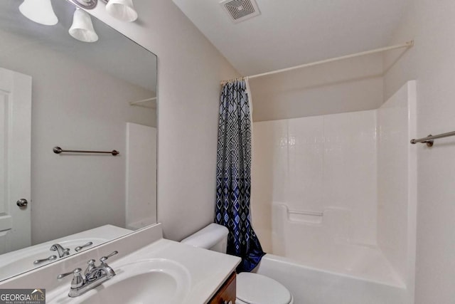 25 Kaktovic Ct, Grayson, GA 30017 - bathroom with toilet, vanity, and shower / bath combo with shower curtain