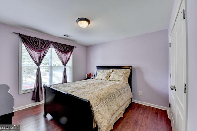 25 Kaktovic Ct, Grayson, GA 30017 - bedroom featuring baseboards and dark wood-style floors