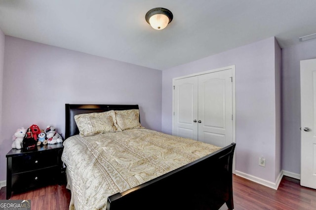 25 Kaktovic Ct, Grayson, GA 30017 - bedroom with dark wood-type flooring, baseboards, and a closet
