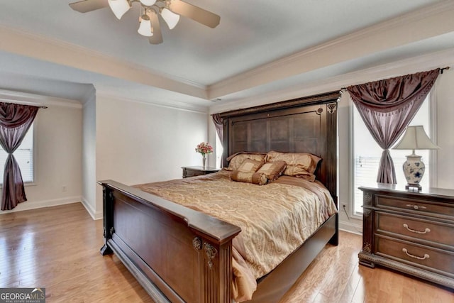 25 Kaktovic Ct, Grayson, GA 30017 - bedroom featuring multiple windows, light wood-style flooring, baseboards, and ornamental molding