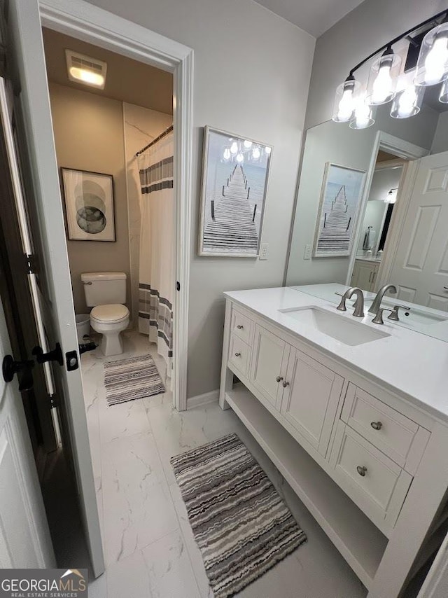 1122 Montclair Dr, Peachtree City, GA 30269 - full bathroom with marble look tiles, toilet, vanity, and baseboards