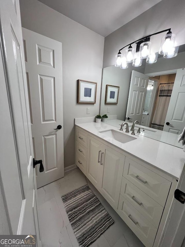 1122 Montclair Dr, Peachtree City, GA 30269 - bathroom featuring marble look tiles, vanity, and a shower with curtain
