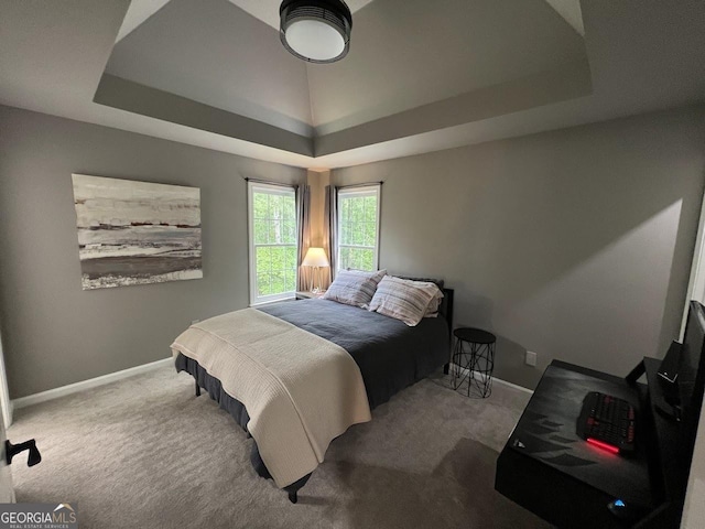 1122 Montclair Dr, Peachtree City, GA 30269 - carpeted bedroom with a tray ceiling and baseboards