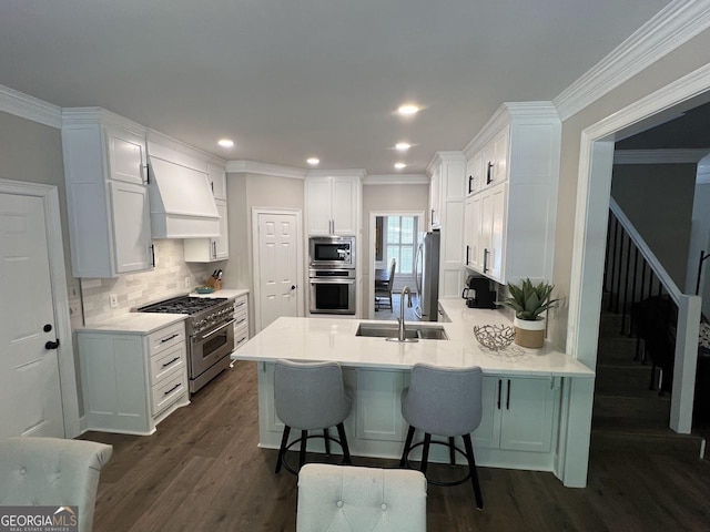 1122 Montclair Dr, Peachtree City, GA 30269 - kitchen with stainless steel appliances, a sink, a peninsula, dark wood-type flooring, and custom exhaust hood