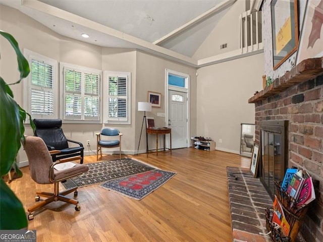 760 Ashland Ave, Atlanta, GA 30307 - living area featuring a fireplace, vaulted ceiling, wood finished floors, recessed lighting, and baseboards