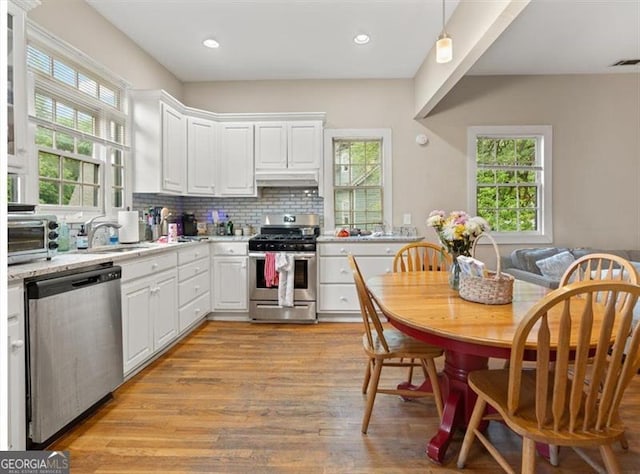 760 Ashland Ave, Atlanta, GA 30307 - kitchen featuring appliances with stainless steel finishes, a sink, plenty of natural light, light wood-style floors, and recessed lighting