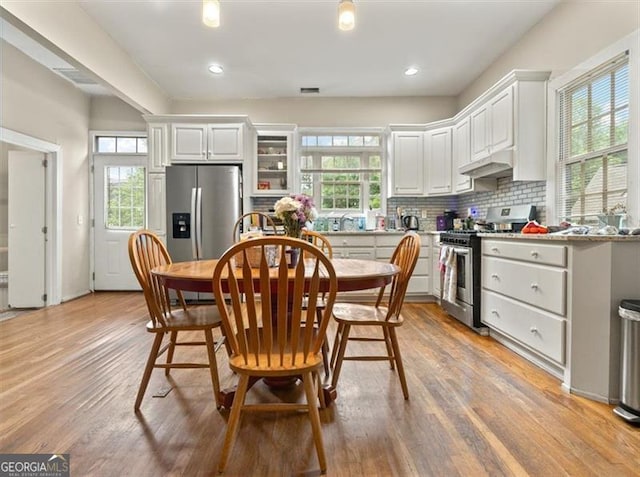 760 Ashland Ave, Atlanta, GA 30307 - dining space with light wood finished floors and recessed lighting