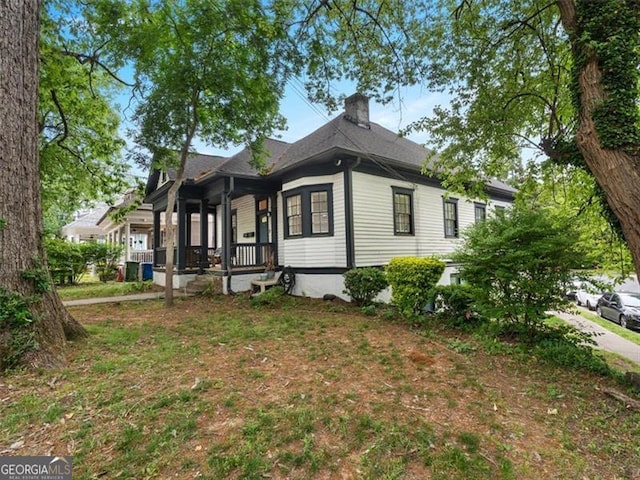 760 Ashland Ave, Atlanta, GA 30307 - view of front of home with a porch and a chimney