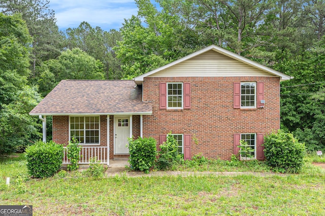 1576 King Mill Rd, Mcdonough, GA 30252 - tri-level home with brick siding, a porch, and a shingled roof