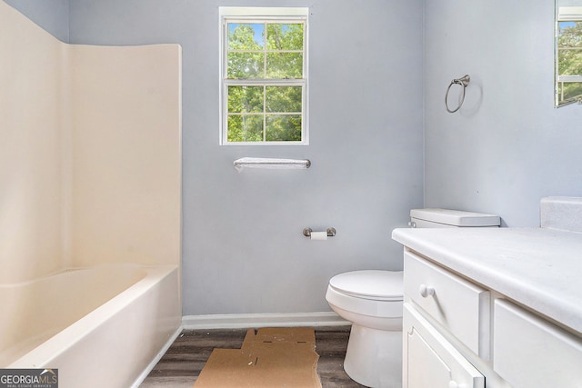 1576 King Mill Rd, Mcdonough, GA 30252 - bathroom with wood finished floors, healthy amount of natural light, vanity, and shower / washtub combination