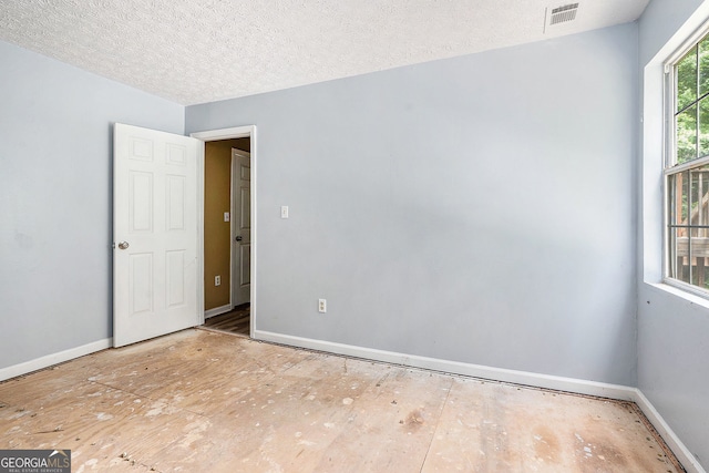 1576 King Mill Rd, Mcdonough, GA 30252 - unfurnished room with baseboards and a textured ceiling