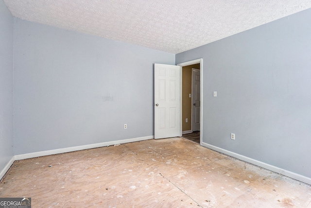 1576 King Mill Rd, Mcdonough, GA 30252 - unfurnished room with a textured ceiling and baseboards