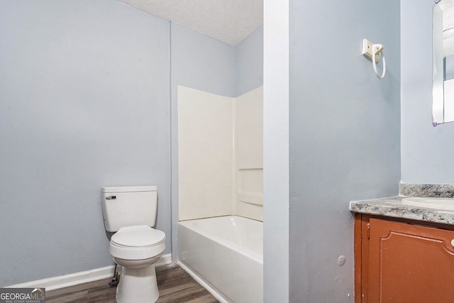 1576 King Mill Rd, Mcdonough, GA 30252 - full bath with vanity, wood finished floors, bathing tub / shower combination, and a textured ceiling