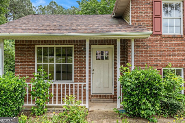 1576 King Mill Rd, Mcdonough, GA 30252 - doorway to property featuring roof with shingles and brick siding