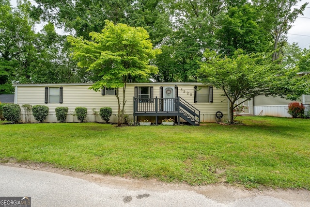 5525 Mount Shores Cir, Gainesville, GA 30506 - manufactured / mobile home with a front lawn and view of wooded area