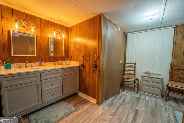 5525 Mount Shores Cir, Gainesville, GA 30506 - bathroom featuring wood finished floors, wooden walls, and double vanity