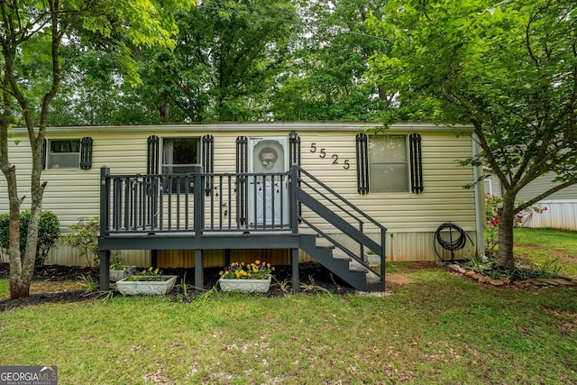 5525 Mount Shores Cir, Gainesville, GA 30506 - back of property featuring a lawn and a wooden deck
