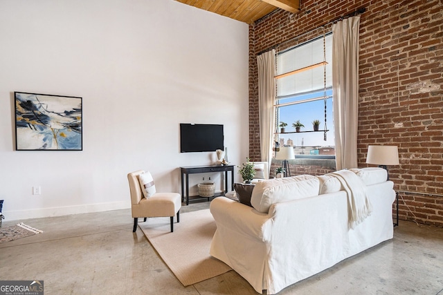 204 Walker St SW Unit 319, Atlanta, GA 30313 - living room with brick wall, wooden ceiling, a towering ceiling, baseboards, and beam ceiling